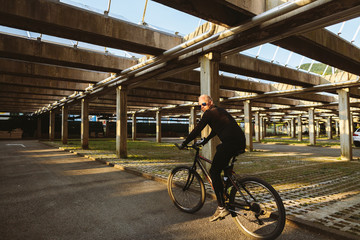 bicycle style man with sunlight. Cycling outdoors at sunset