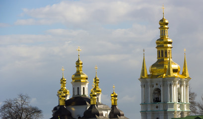 Domes of Kiev Pechersk Lavra against the background of a cloudy sky