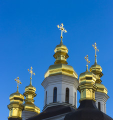 Domes of Kiev Pechersk Lavra against the background of a cloudy sky