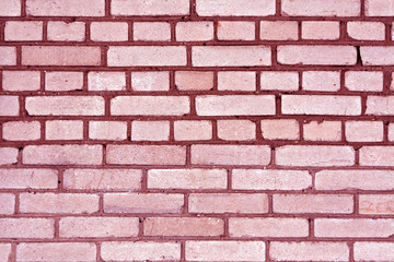 Pink color grungy brick wall pattern.