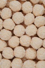 Pile of homemade sweets. Toffee and coconut balls