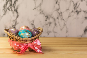 Easter eggs with gold marble decorations on the marble background