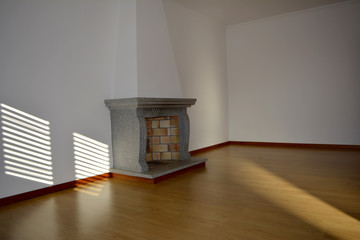 Empty Living Room with fireplace and sunlight projection on the wall