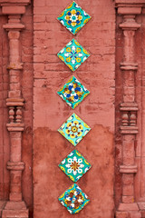 Glazed tiles and decorative bricks. Detail of decoration. Church of Epiphany (built in 1684). Yaroslavl city, Russia.