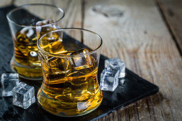 Whiskey with ice in glasses
