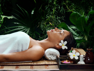 portrait of young beautiful woman in spa environment - 141272304