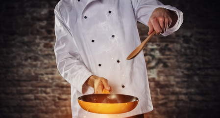 Closeup of chef holding empty grill pan