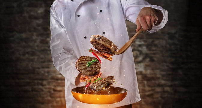 Closeup Of Chef Preparing Milled Beef Meat On Grill Pan