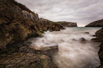 Fototapeta na wymiar Landscape with long exposure on the coast of Cue. Asturias. Spain.