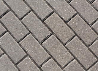 Gray color cobblestone pavement close-up