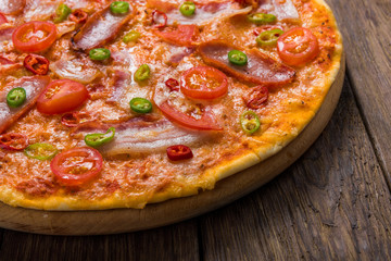 Delicious pizza with red and green hot chili peppers