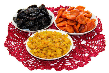 dried fruit, nuts and honey on a plate