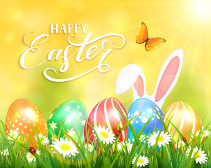 Happy Easter on yellow background with bunny and eggs