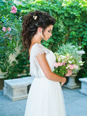 Tender beautiful bride with a bouquet