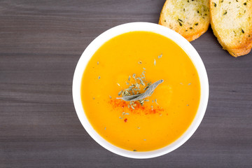 vegetable cream soup bowl on table