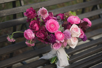 Beautiful wedding bouquet. Pink roses and other flowers.