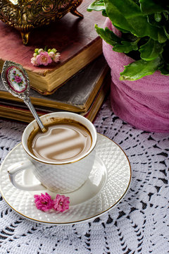 Beautiful still life in vintage style with coffee Cup and books.