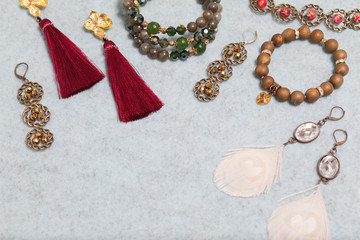 Handmade jewelry on the gray woolen background