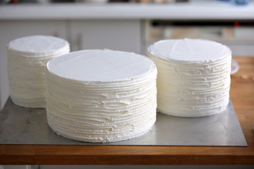 Three separate layers of one naked torte cake before putting together