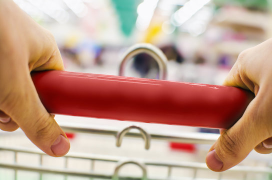 Woman Pushing Shopping Cart