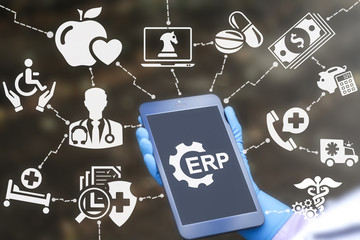 ERP (Enterprise Resource Planning) healthcare concept. Doctor holds tablet computer with erp gear...