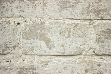 Old brick wall of white color closeup