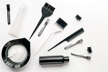 hairdresser woorking desk with tools on white background top view