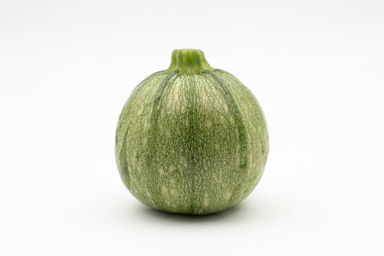 round zucchini on white background - courgette