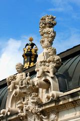 Fototapeta na wymiar Richly sculptured Rampart Pavilion. Zwinger Palace (architect Matthaus Poppelmann) - royal palace 17 century in Dresden.