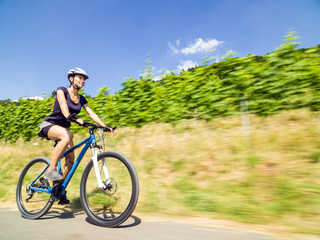 Fototapeta premium Young Woman On Mountain Bike