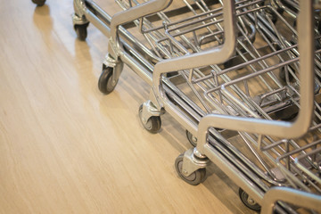 luggage bag carts ,trolleys luggage in a row in modern airport, retro filter effect,selective focus..