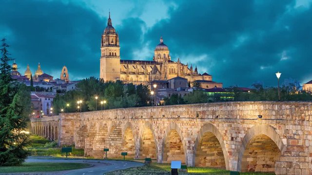 Romana Bridge with New Cathedral at the background in the evening, Salamanca, Spain (static image with animated sky)
