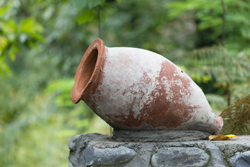 Decorative clay pot over blurred background