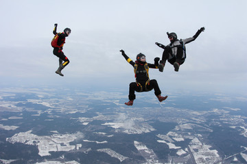 Skydivers make fun in the sky.