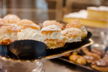 Small sweet cakes with a large layer of whipped cream