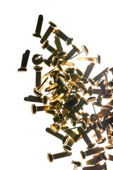 Stack of office supplies brass fasteners paper clips isolated on white