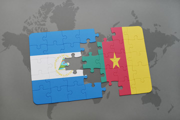 puzzle with the national flag of nicaragua and cameroon on a world map