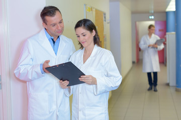 Male and female nursing staff in discussion