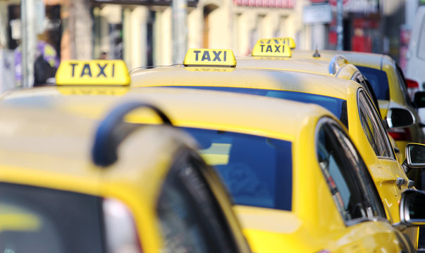 Taxi Cab Standing On The Airport Waiting Stand