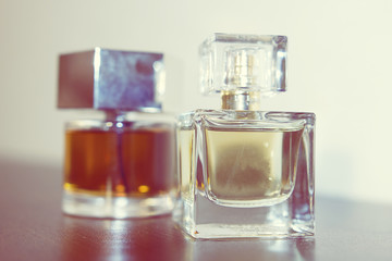 Two bottles of perfume on the table
