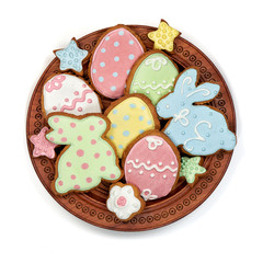 easter gingerbread in wooden plate on white background