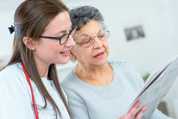 Doctor reading to a patient