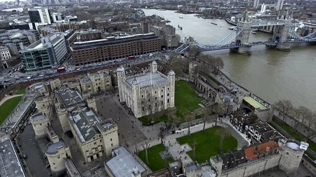 Aerial View Flying Over Tower of London Wall Castle with Tower Bridge and River Thames in England, UK 