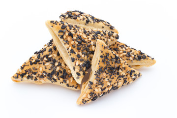 Crisps with nuts and seeds stacked on a white background.