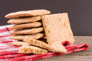 stack of crisp bread on a wooden table