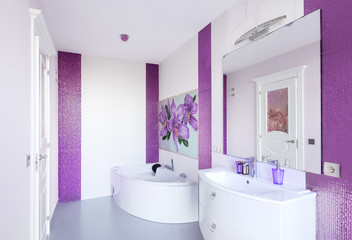 Naklejka na ściany i meble Modern Bathroom interior with a mosaic panel. White bathtub against violet and white wall