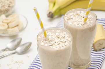 Milk shake with banana and oatmeal, healthy breakfast