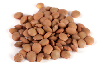 Pile of lentils isolated on white background