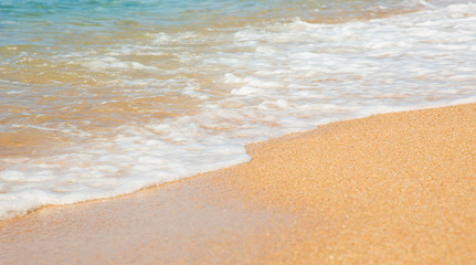 Background the sandy beach.