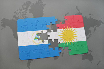 puzzle with the national flag of nicaragua and kurdistan on a world map